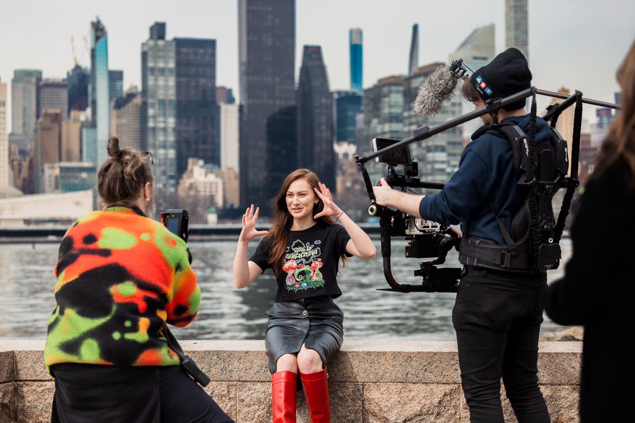 RIOT crew filming an interview with Lola Tung at the Coachtopia launch shoot, the Manhattan skyline behind