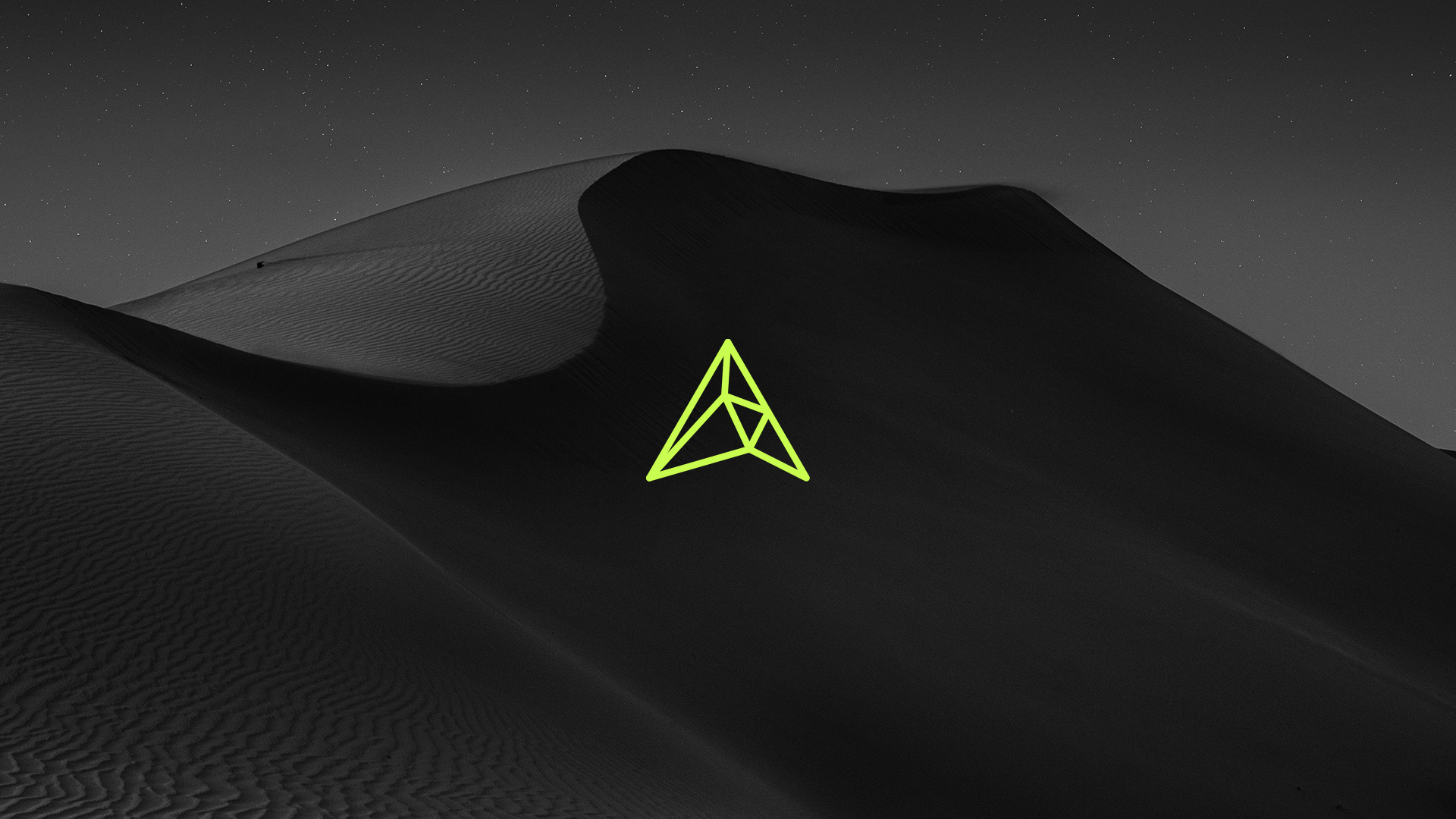 The latest AltSounds TV logo, introduced in 2024, designed by RIOT. A neon geometric emblem set against a black-and-white desert landscape, symbolizing the platform’s bold and modern creative direction.