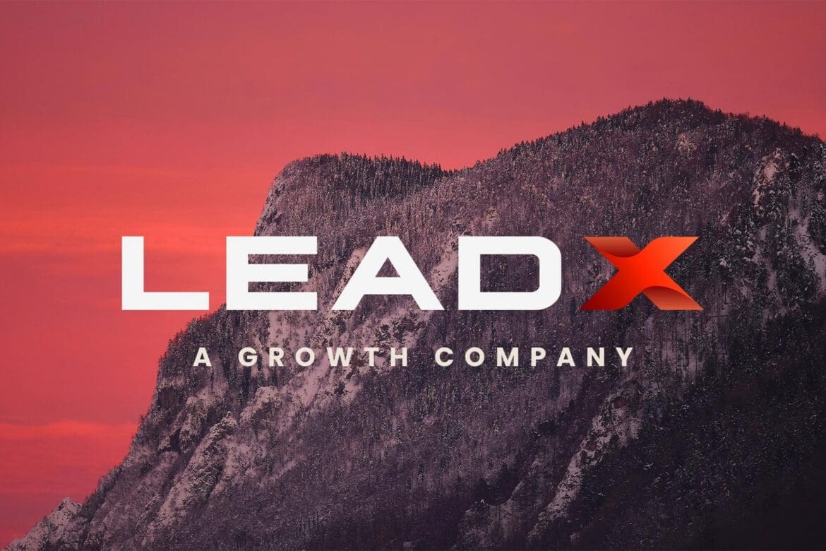 LEADX logo featured against a bold red mountain backdrop with the slogan "A Growth Company"