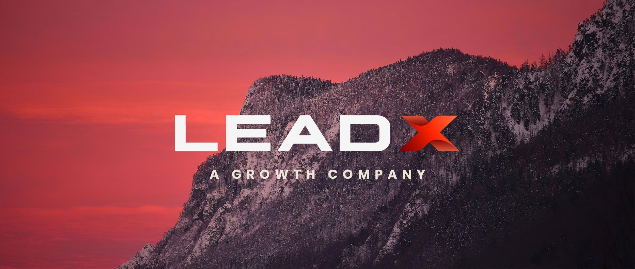 LEADX logo featured against a bold red mountain backdrop with the slogan "A Growth Company"