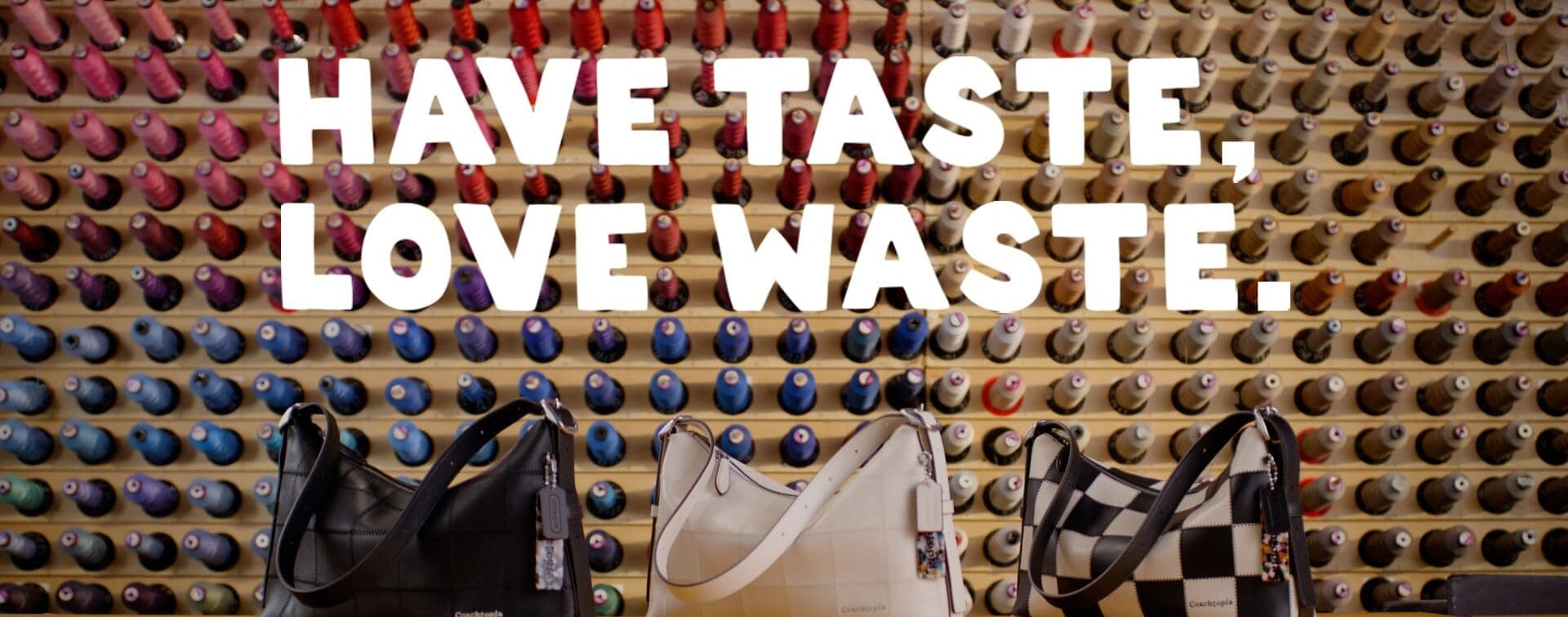 Have Taste, Love Waste: The Alter/Ego Collection Three Coachtopia Alter/Ego bags in different colors, displayed in front of a colorful thread wall with the words ‘Have Taste, Love Waste.’