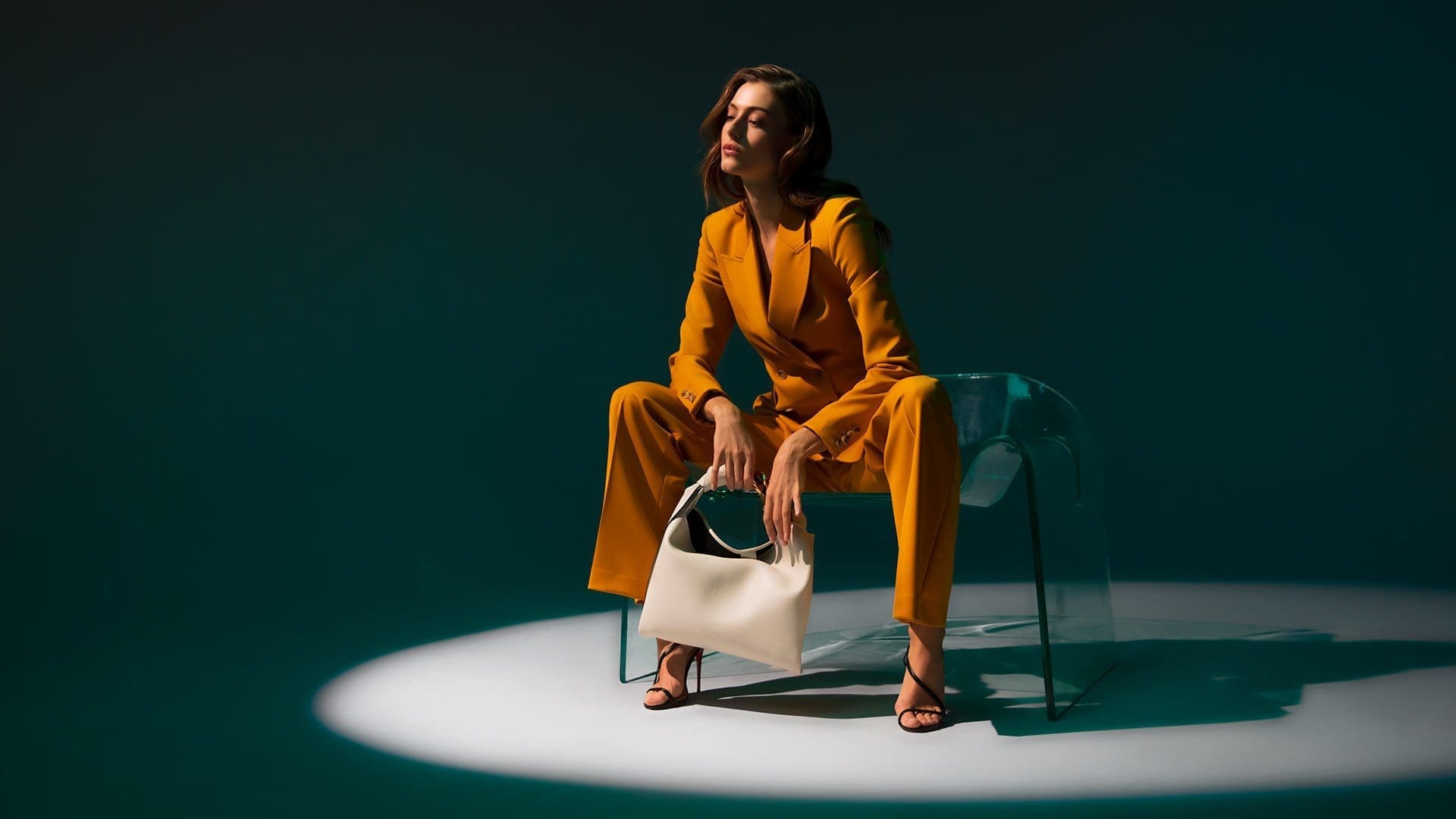 RIOT, NYC Creative Agency: Neiman Marcus Mustard Power Suit - Sitting On Ghost Chair by Fiam Italia Neiman Marcus Mustard Power Suit - Sitting On Ghost Chair by Fiam Italia