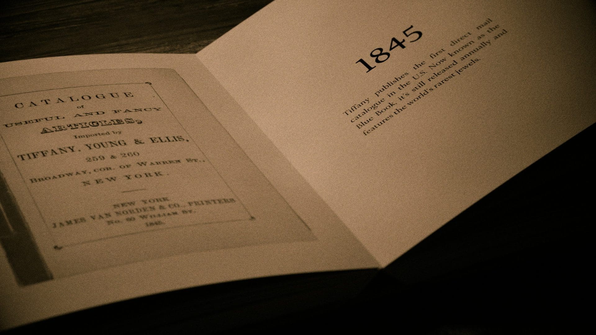 RIOT, NYC Creative Agency: Open replica of Tiffany & Co.'s first ever Blue Book catalog from 1845 with historical description, showcasing the brand's legacy in luxury goods and its longstanding New York City roots. Open replica of Tiffany & Co.'s first ever Blue Book catalog from 1845 with historical description, showcasing the brand's legacy in luxury goods and its longstanding New York City roots.
