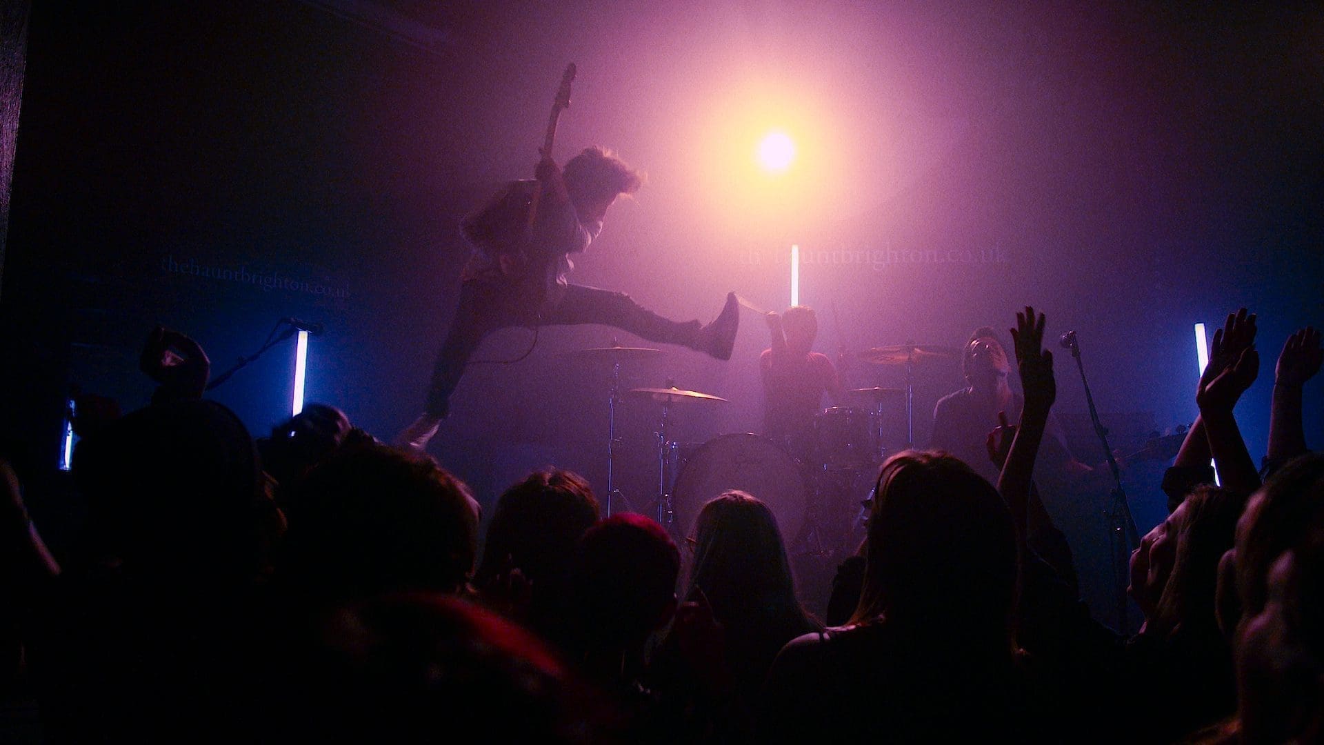 RIOT, NYC Creative Agency: The Xcerts band member mid-air jump during a live performance scene from the "Daydream" music video. The Xcerts band member mid-air jump during a live performance scene from the "Daydream" music video.
