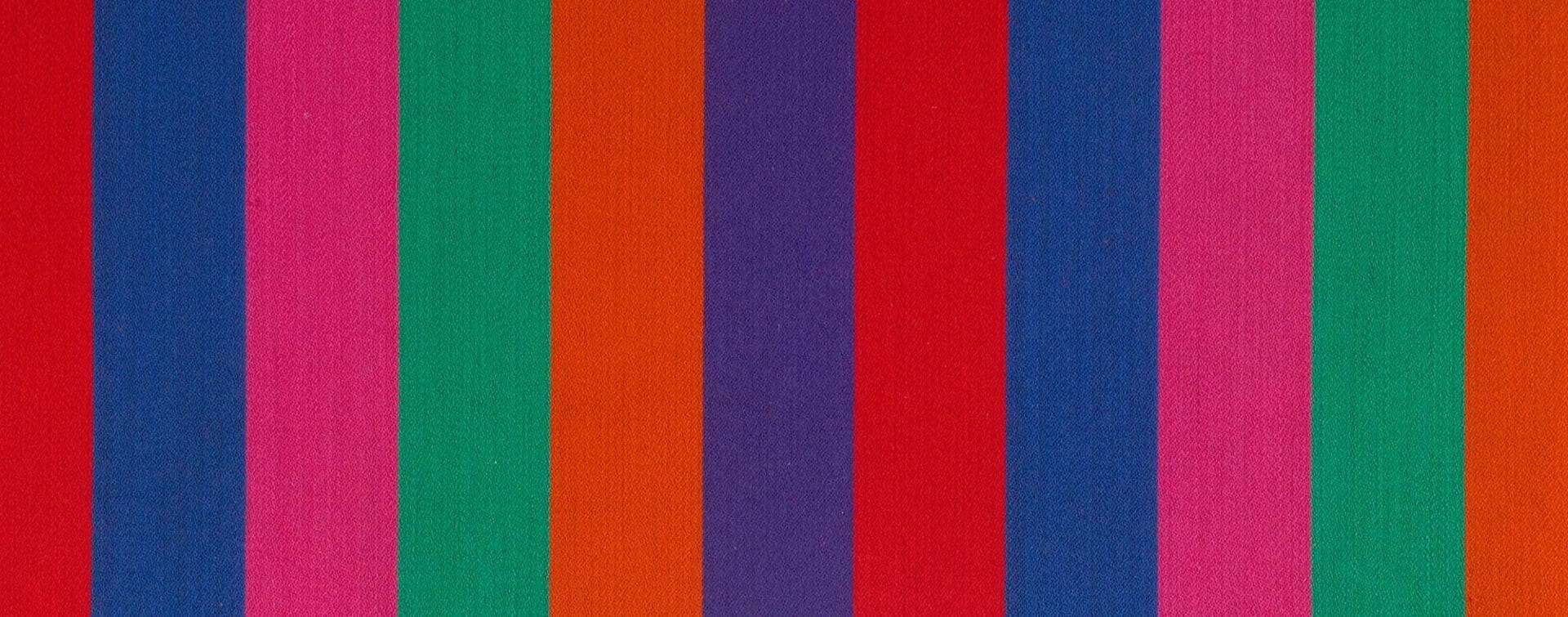 Vibrant striped fabric design by Alexander Girard called Jacob’s Coat
