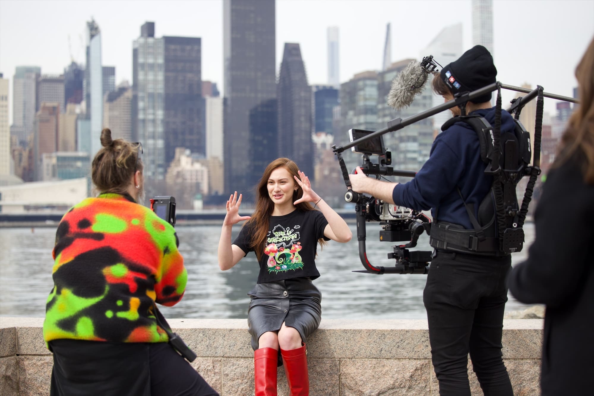 RIOT interviewing Lola Tung on the Long Island City waterfront, camera on a gimbal and a boom mic overhead