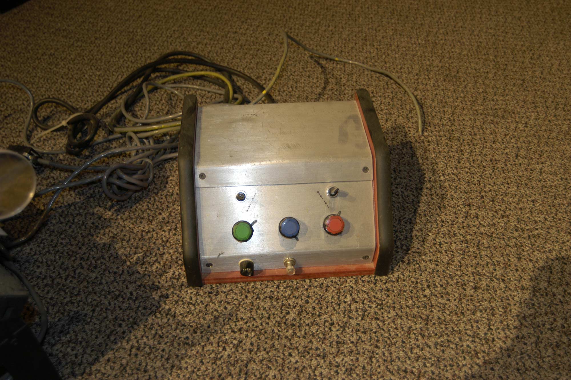  A photograph of the control panel for Nikola Tesla’s Death Ray device, featuring buttons and switches.