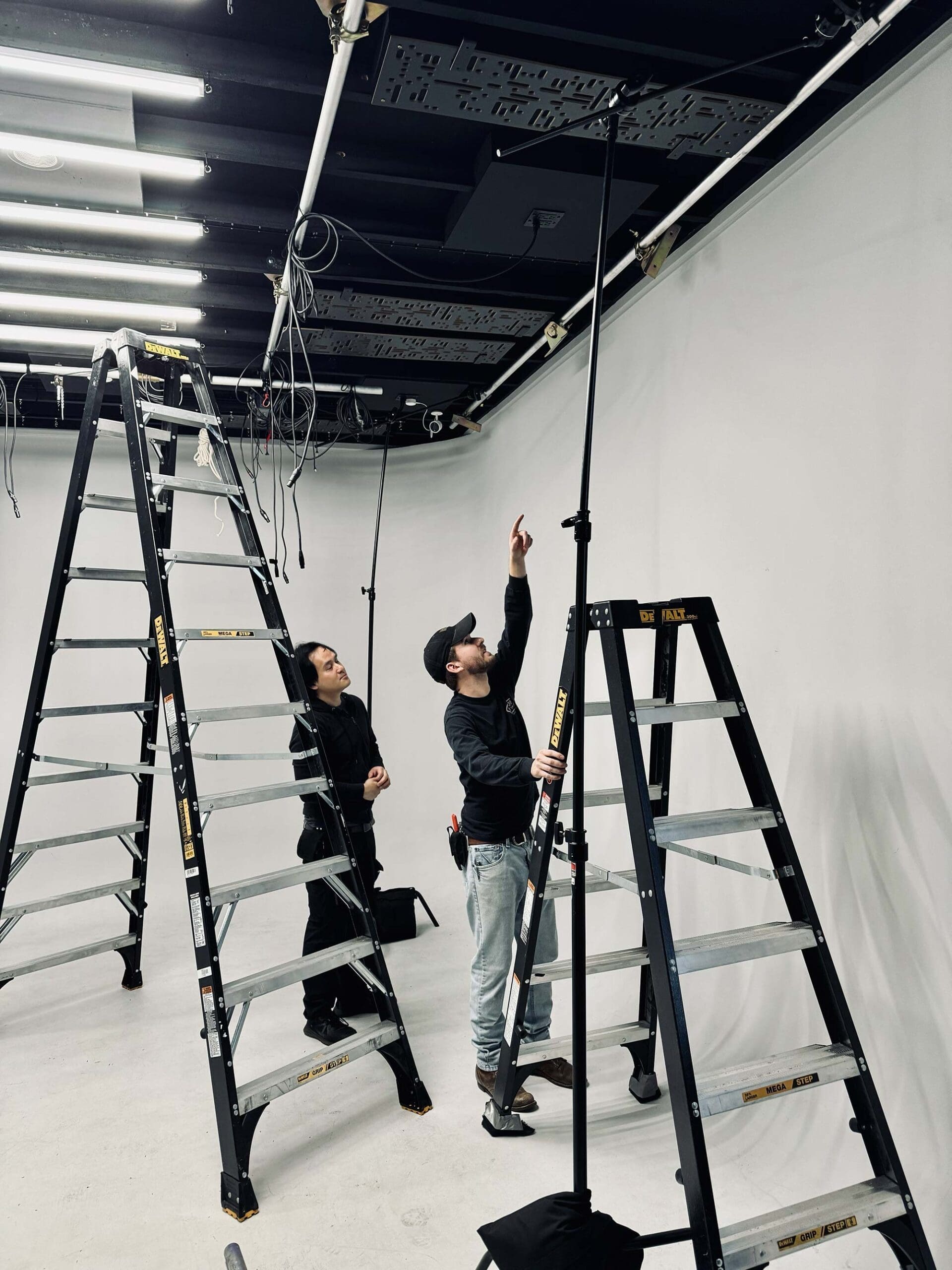 RIOT, NYC Creative Agency: Gaffer and grip installing new rafter mounts for lighting grid at RIOT’s Grove Street Studio. Gaffer and grip installing new rafter mounts for lighting grid at RIOT’s Grove Street Studio.