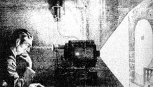 An illustration of Nikola Tesla sitting beside his theoretical Thought Camera, designed to capture human thoughts and project them as images.