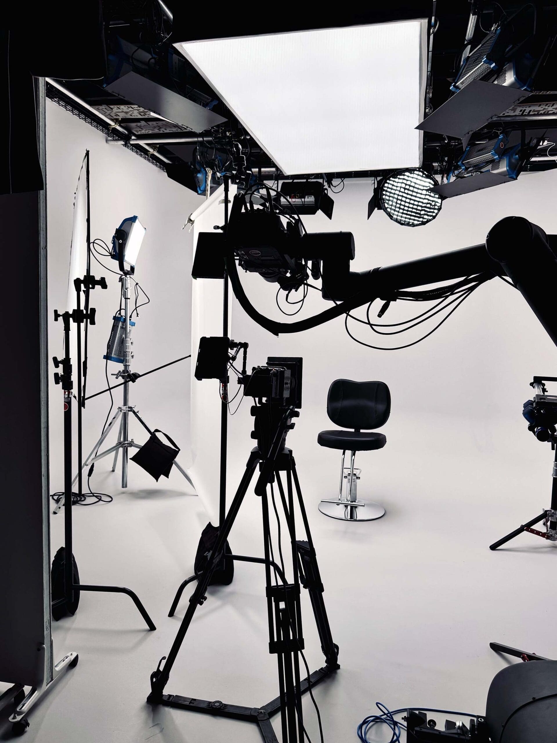 RIOT, NYC Creative Agency: Cyclorama stage setup with professional lighting and an empty chair for John Frieda Frizz Ease shoot. Cyclorama stage setup with professional lighting and an empty chair for John Frieda Frizz Ease shoot.