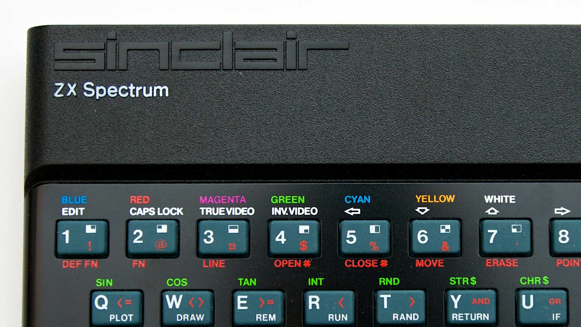 Close-up of the ZX Spectrum 48K keyboard showing the colorful command keys