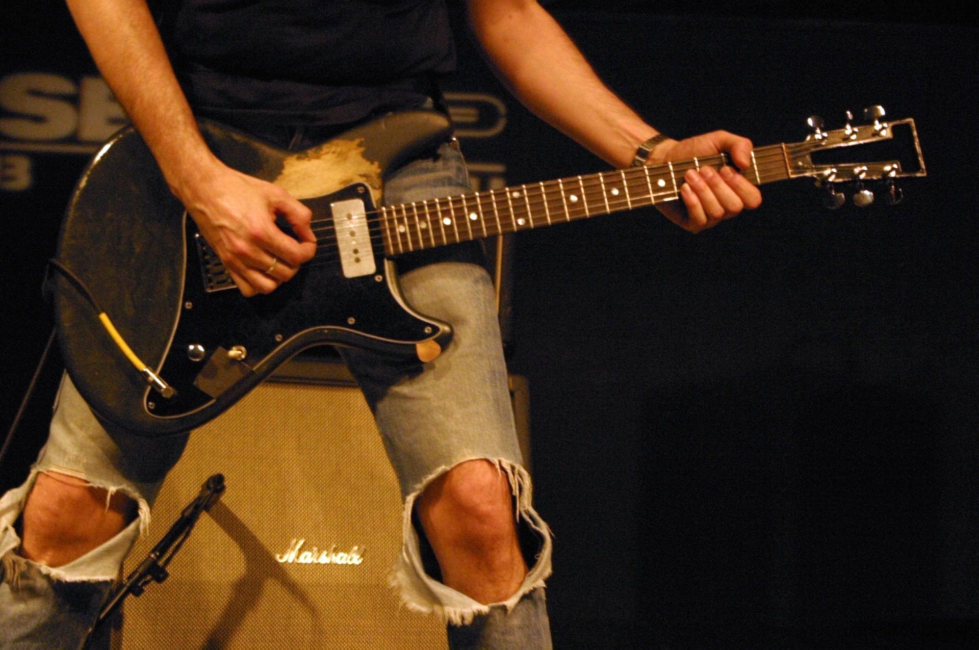 RIOT, NYC Creative Agency: Steve Albini playing guitar during a Shellac performance. Steve Albini playing guitar during a Shellac performance.