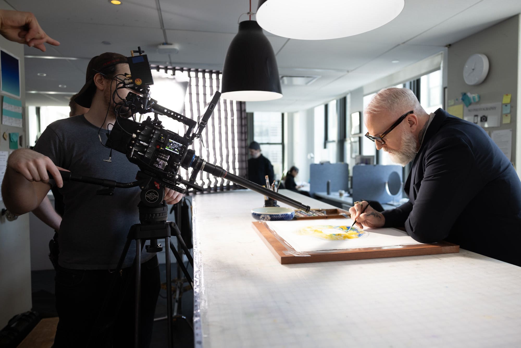 RIOT filming Christopher Young drawing at the long table in Tiffany's windows studio for RIOT's Tiffany & Co. Chengdu windows film