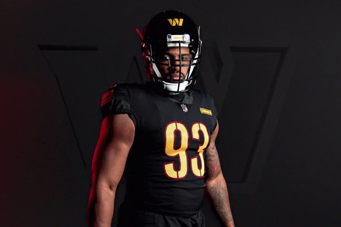 Washington Commanders players in the new black, white and burgundy uniforms from the 2022 rebrand